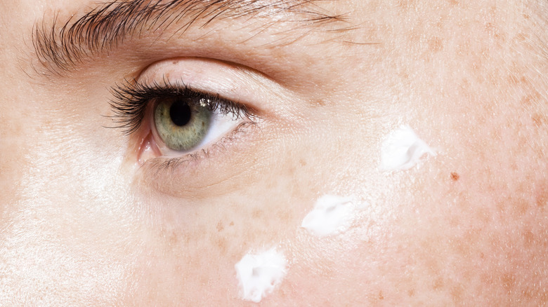 Close-up of moisturizer on a woman's cheek