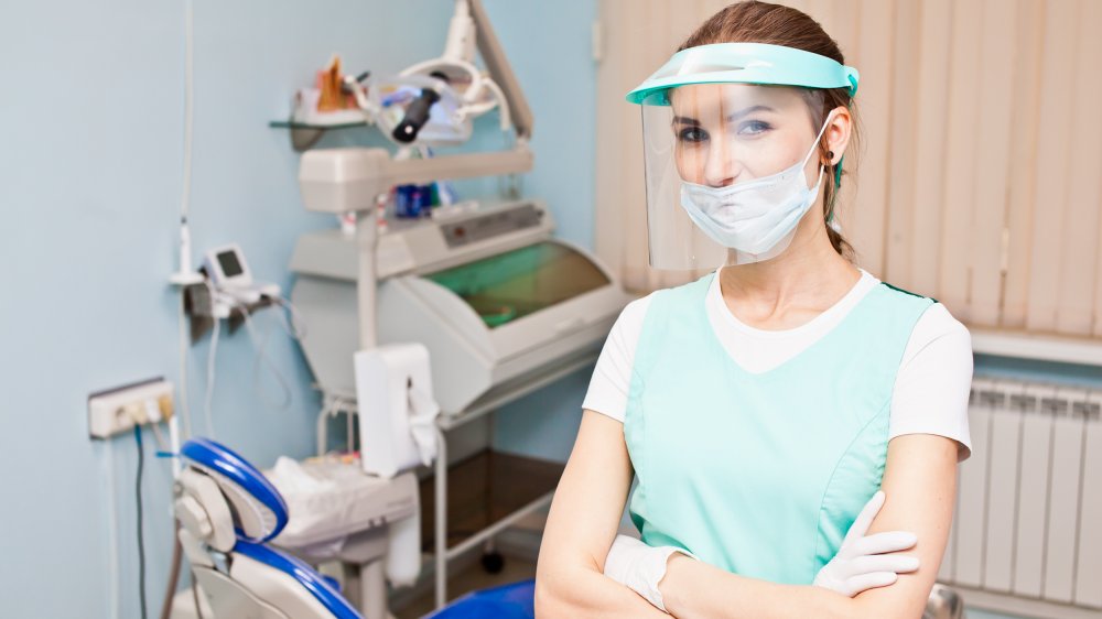 Dentist in face shield