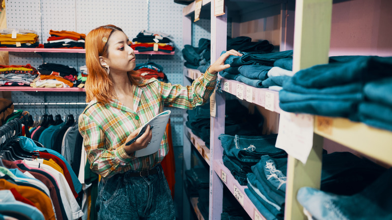 Woman at store taking notes