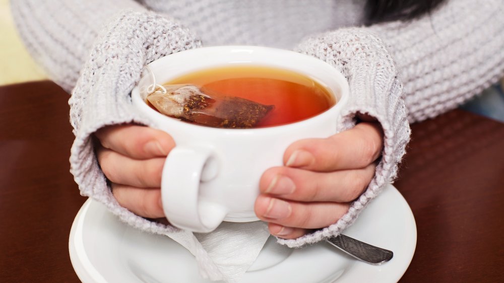 woman drinking hot tea