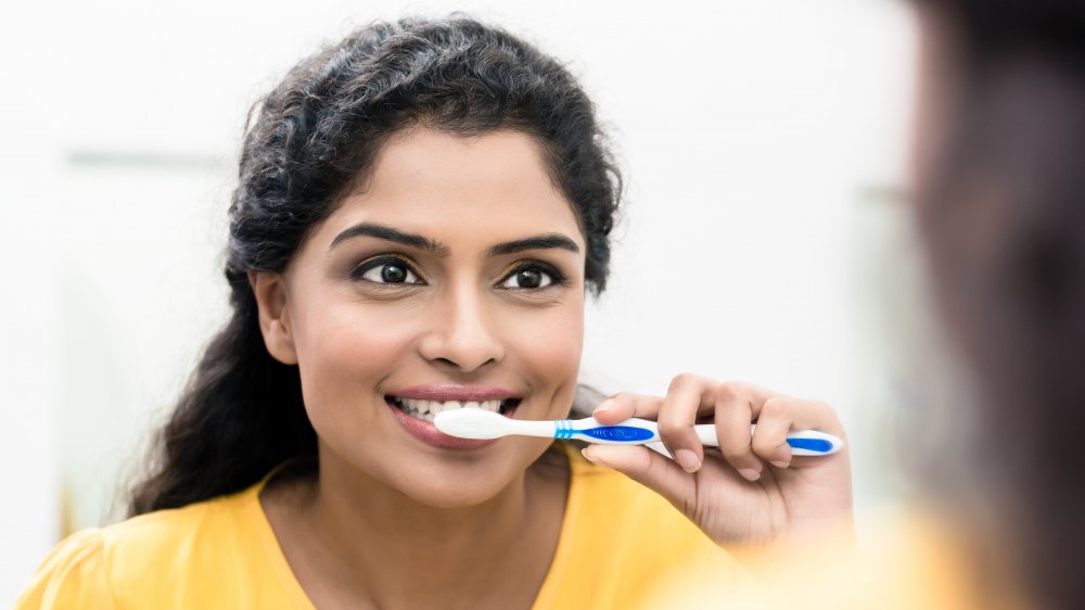 Woman brushing her teeth