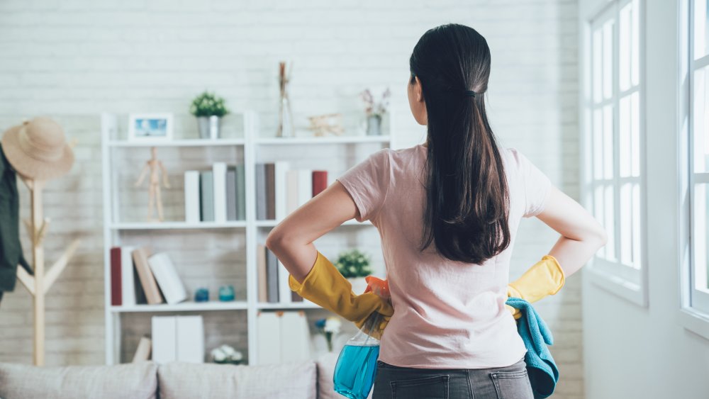 Woman with cleaning supplies