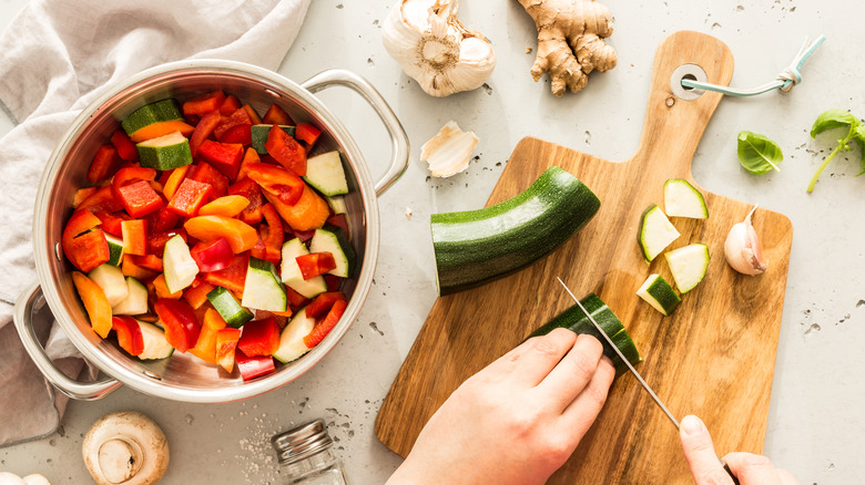 A wooden cutting board in use 