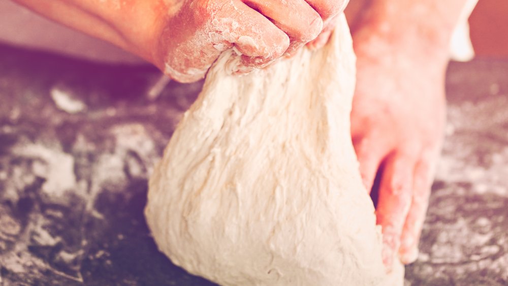 Baker preparing sourdough bread