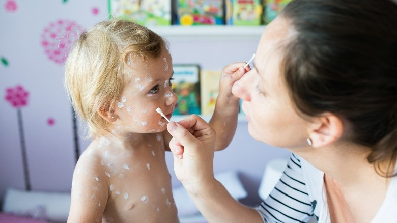 Mother and baby with Q-tips