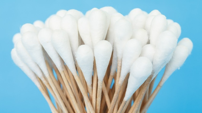 Q-tips against blue background