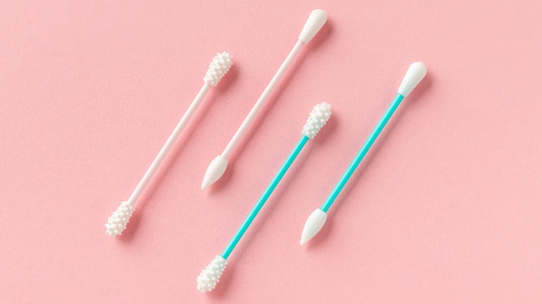 Q-tips on pink background
