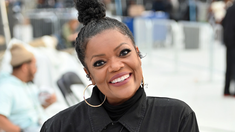 Yvette Nicole Brown smiling outside