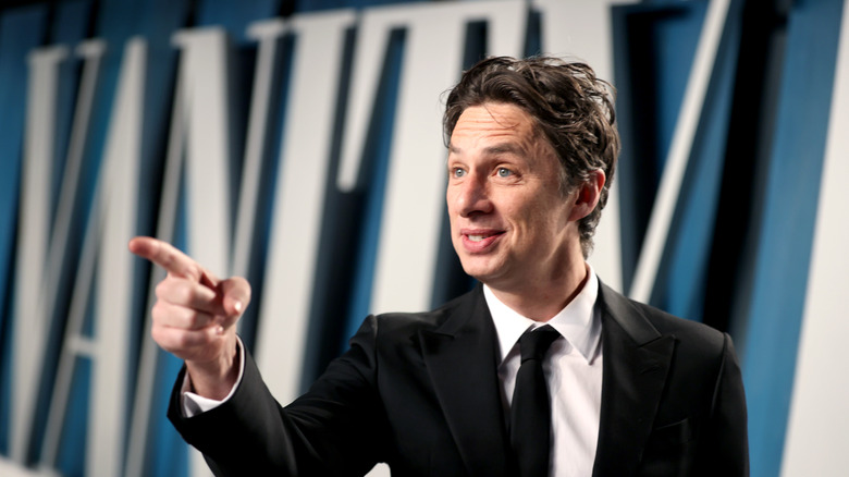 Zach Braff pointing in suit