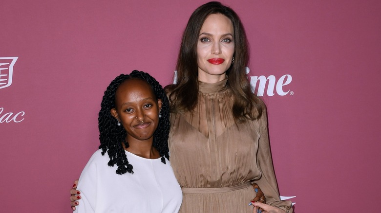 Zahara Jolie-Pitt and Zahara Jolie posing 