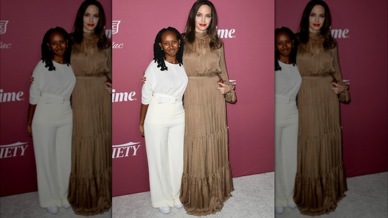 Zahara Jolie-Pitt and Angelina Jolie posing 