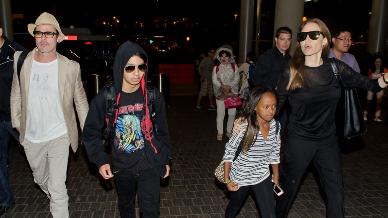 brad pitt, angelina jolie, zahara and maddox jolie-pitt walking