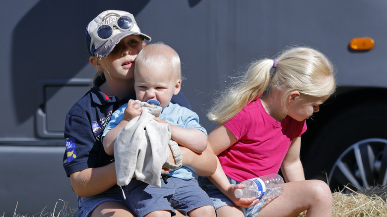 Mia, Lena, and Lucas Tindall posing 