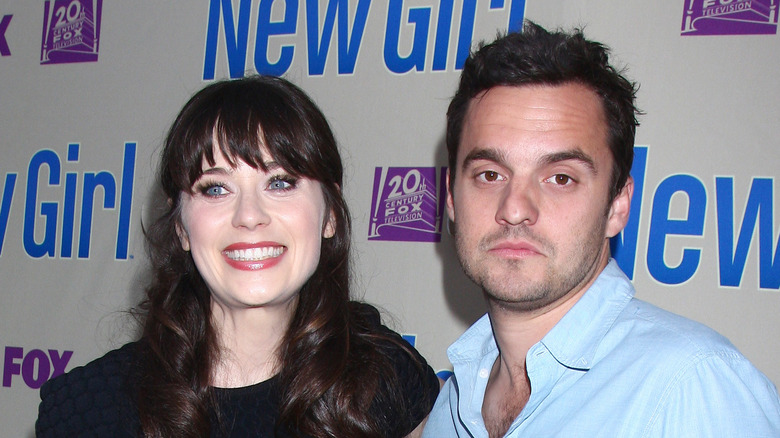 Zooey Deschanel and Jake Johnson smiling